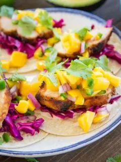 Grilled Chicken Tacos with Mango Salsa, cabbage slaw, and chipotle sour cream - a fresh, vibrant, and unique take on tacos!