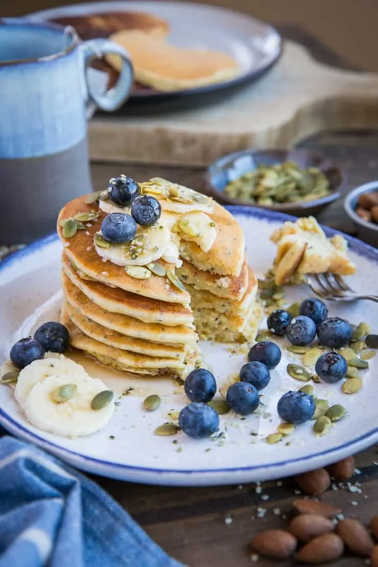 Paleo Lemon Poppy Seed Pancakes made with almond flour and almond milk. This zesty stack is healthy and delicious! Dairy-free, refined sugar-free, and grain-free