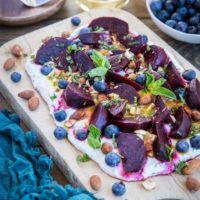 Roasted Beet Salad with Herbed Whipped Ricotta and Citrus Dressing with roasted almonds and blueberries - a perfect sharable dish for brunch