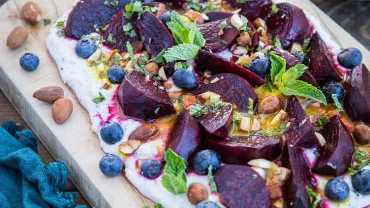Roasted Beet Salad with Herbed Whipped Ricotta and Citrus Dressing with roasted almonds and blueberries - a perfect sharable dish for brunch