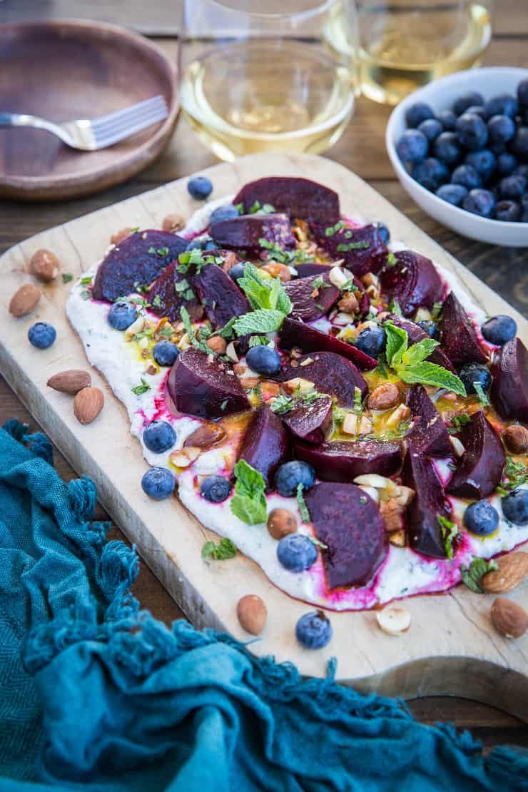 Roasted Beet Salad with Herbed Whipped Ricotta and Citrus Dressing with roasted almonds and blueberries - a perfect sharable dish for brunch