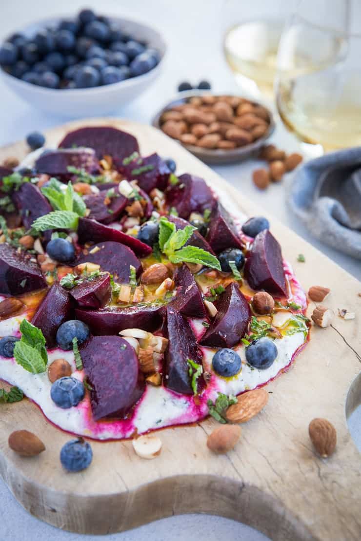 Roasted Beet Salad with Herbed Whipped Ricotta and Citrus Dressing with roasted almonds and blueberries - a perfect sharable dish for brunch