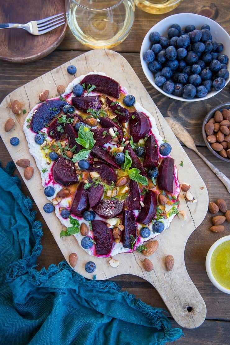 Roasted Beet Salad with Herbed Whipped Ricotta and Citrus Dressing with roasted almonds and blueberries - a perfect sharable dish for brunch