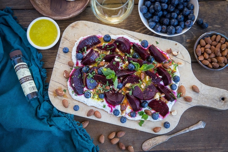 Roasted Beet Salad with Herbed Whipped Ricotta and Citrus Dressing with roasted almonds and blueberries - a perfect sharable dish for brunch