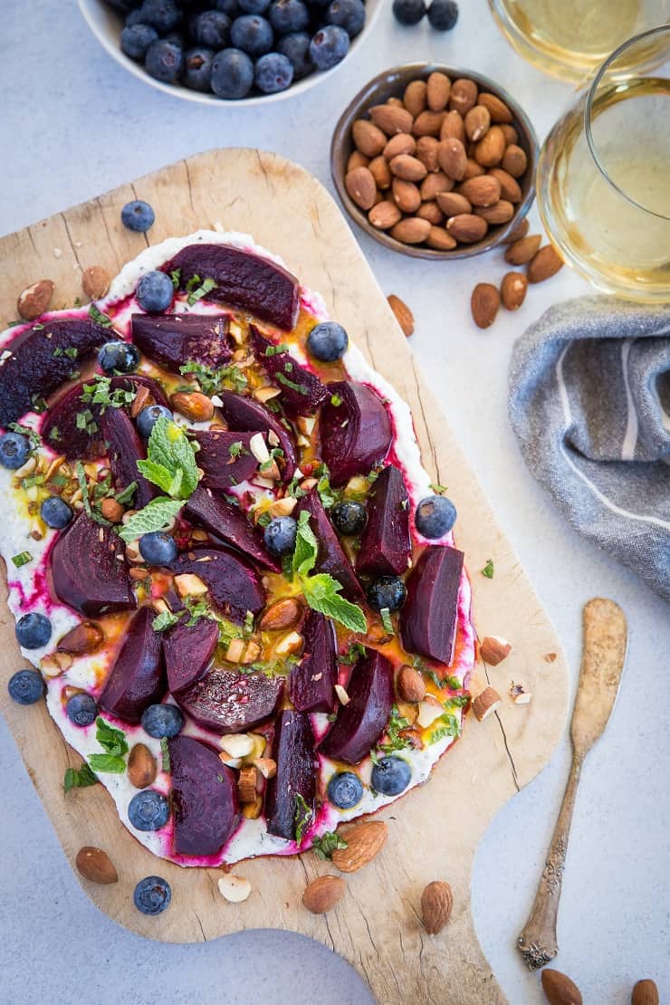 Roasted Beet Salad with Herbed Whipped Ricotta and Citrus Dressing with roasted almonds and blueberries - a perfect sharable dish for brunch