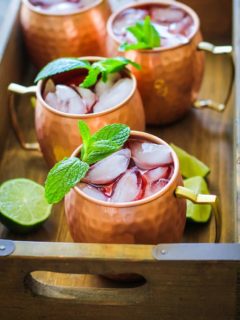 Strawberry Moscow Mules - a lower sugar Moscow Mule recipe with homemade strawberry simple syrup for a skinny cocktail