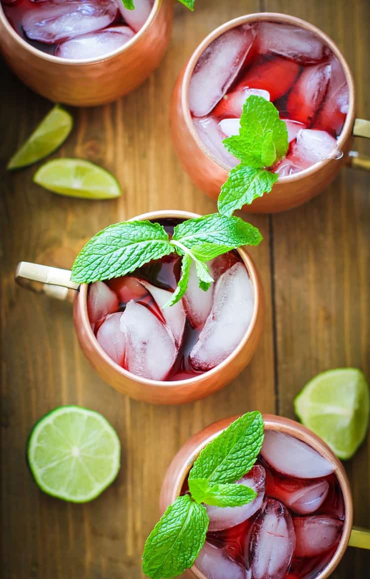 Strawberry Moscow Mules - a lower sugar Moscow Mule recipe with homemade strawberry simple syrup for a skinny cocktail