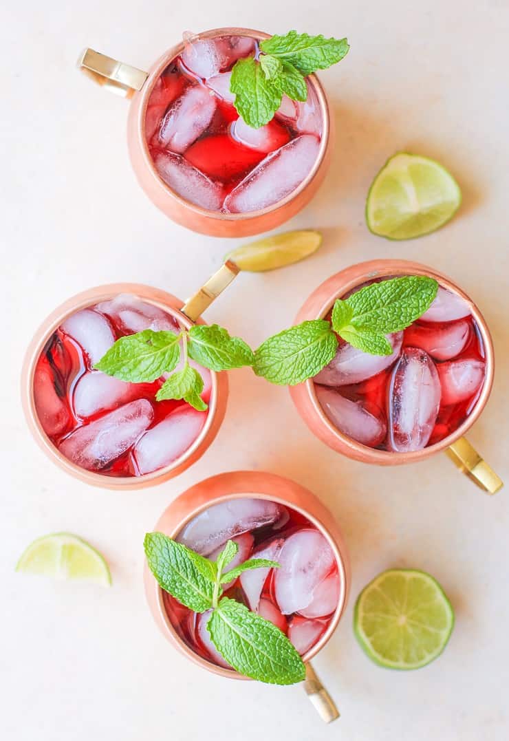 Strawberry Moscow Mules - a lower sugar Moscow Mule recipe with homemade strawberry simple syrup for a skinny cocktail