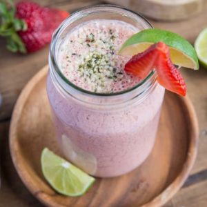 Strawberry Protein Smoothie - packed with plant-based protein, cauliflower, almond milk, yogurt, almond butter, dates and lime juice, this healthy banana-free smoothie is a perfect post-workout meal in a glass