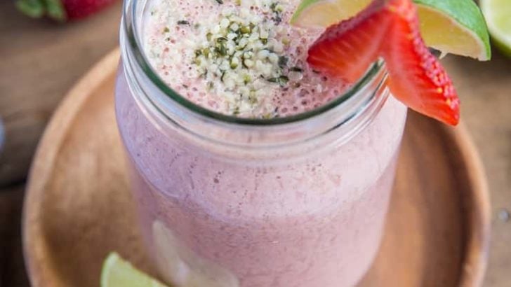 Strawberry Protein Smoothie - packed with plant-based protein, cauliflower, almond milk, yogurt, almond butter, dates and lime juice, this healthy banana-free smoothie is a perfect post-workout meal in a glass