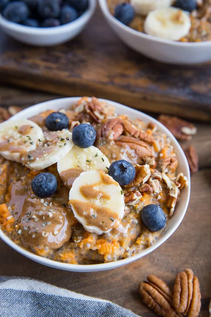 Sweet Potato Porridge with chia seeds, almond milk, pure maple syrup, banana, blueberries, pecans, and almond butter. A nutritious breakfast, snack or dessert!