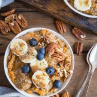 Sweet Potato Porridge with chia seeds, almond milk, pure maple syrup, banana, blueberries, pecans, and almond butter. A nutritious breakfast, snack or dessert!