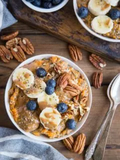 Sweet Potato Porridge with chia seeds, almond milk, pure maple syrup, banana, blueberries, pecans, and almond butter. A nutritious breakfast, snack or dessert!