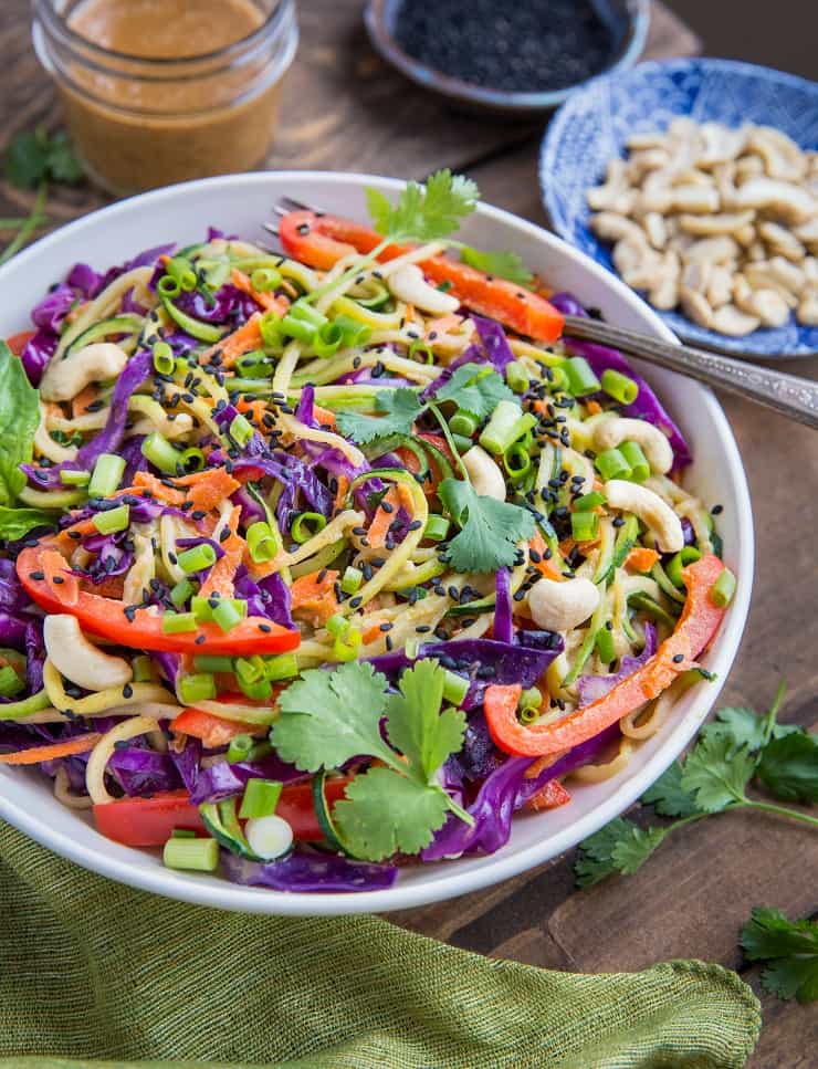 Thai Zucchini Noodles with Sesame Almond Ginger Sauce - a healthy plant-based meal that's both paleo and vegan and only requires 30 minutes to make