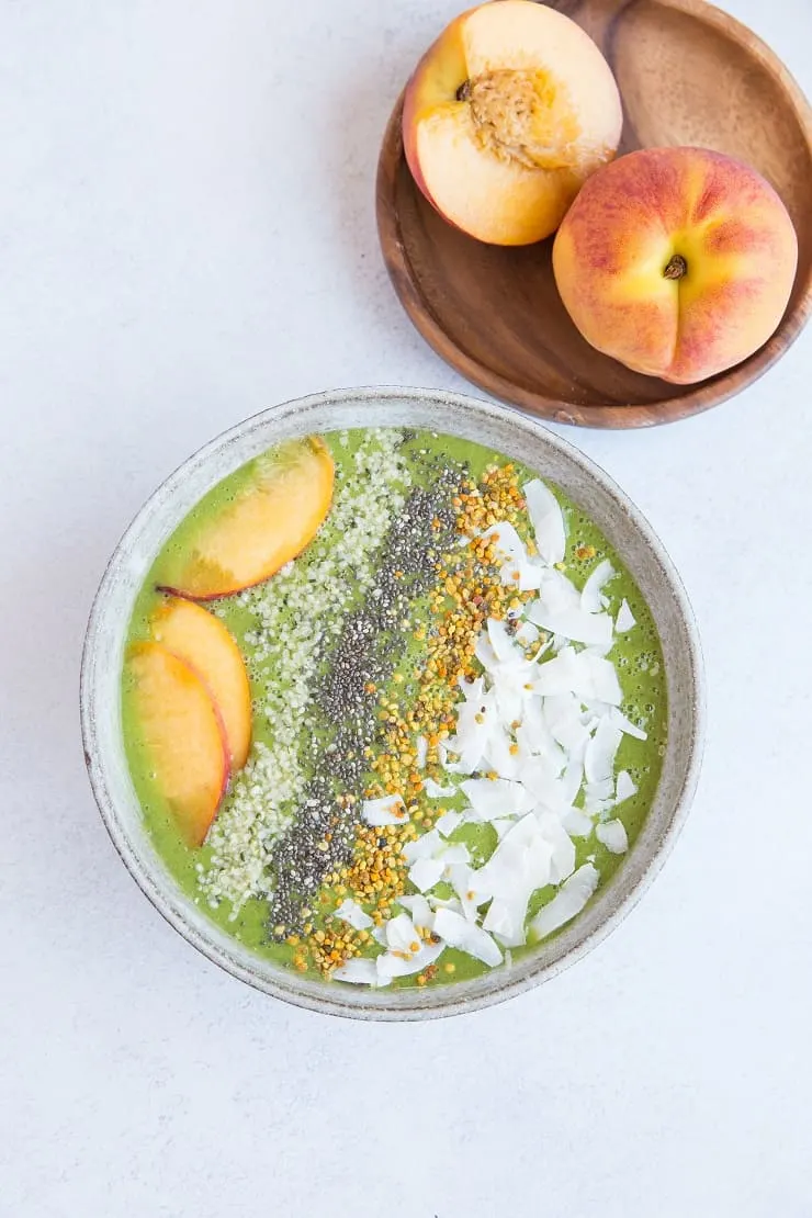 Ginger Peach Smoothie Bowl made banana-less using steamed and frozen cauliflower, orange juice, and almond milk. A healthy, vibrant breakfast