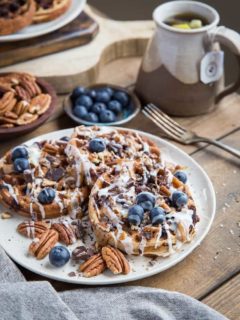 Paleo Chocolate Pecan Waffles with almond butter, coconut butter, and blueberries. This grain-free waffle recipe is prepared in your blender and tastes magnificent!