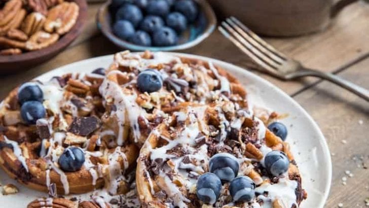 Paleo Chocolate Pecan Waffles with almond butter, coconut butter, and blueberries. This grain-free waffle recipe is prepared in your blender and tastes magnificent!