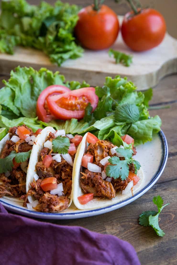 Carnitas and Chorizo Tacos - slow cooked shredded pork and chorizo make an amazingly flavorful taco! Set it up in the morning and have it ready by the time you get home from work! | TheRoastedRoot.net #glutenfree