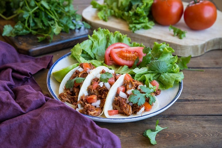 Carnitas and Chorizo Tacos - slow cooked shredded pork and chorizo make an amazingly flavorful taco! Set it up in the morning and have it ready by the time you get home from work! | TheRoastedRoot.net #glutenfree