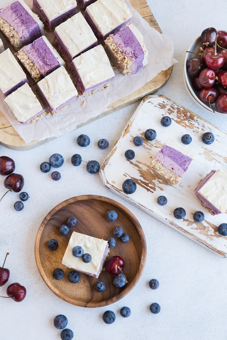 Cherry Blueberry Vegan Layered Cheesecake Bars - gorgeous cheesecake made with soaked cashews and pure maple syrup for a dairy-free take on cheesecake. | TheRoastedRoot.com