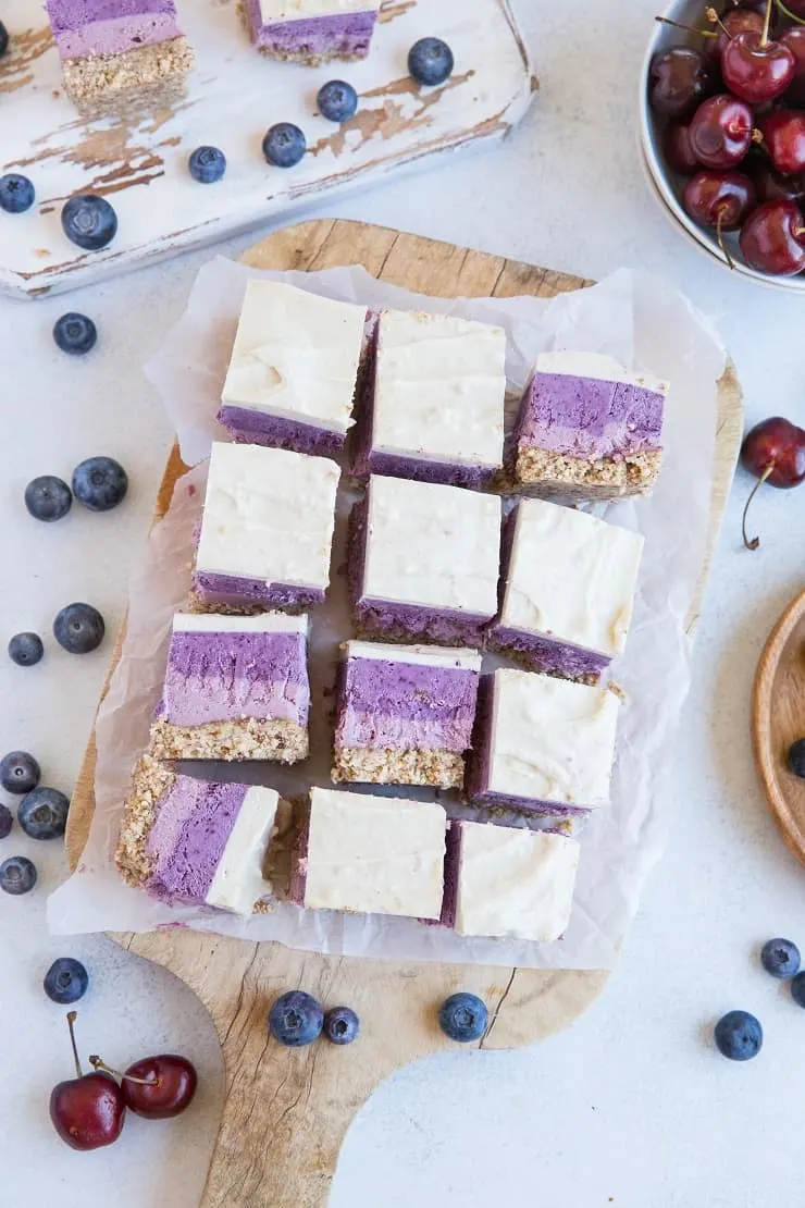 Cherry Blueberry Vegan Layered Cheesecake Bars - gorgeous cheesecake made with soaked cashews and pure maple syrup for a dairy-free take on cheesecake. | TheRoastedRoot.com