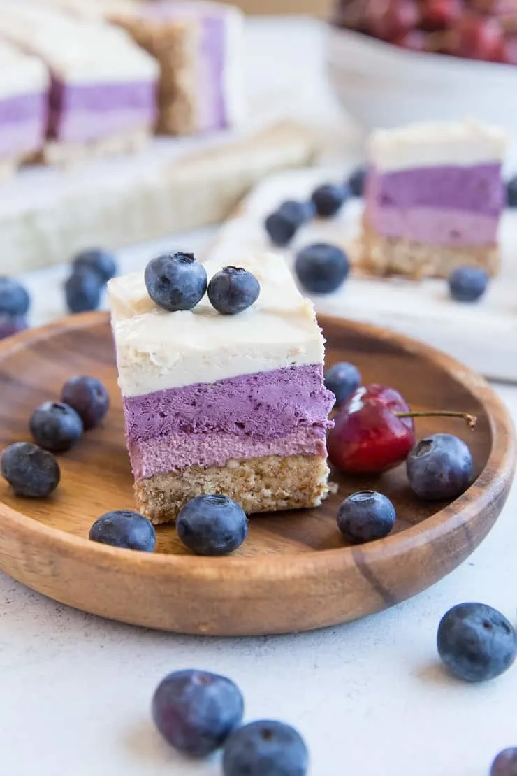 Dairy-Free Cherry Blueberry Vegan Layered Cheesecake Bars - gorgeous cheesecake made with soaked cashews and pure maple syrup for a dairy-free take on cheesecake. | TheRoastedRoot.com