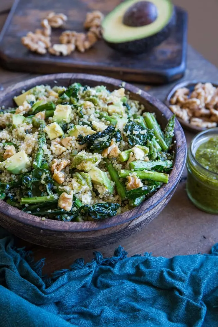 Pesto Quinoa Salad with Kale, Asparagus, Avocado, Walnuts, and Feta. A light and refreshing side dish perfect for sharing