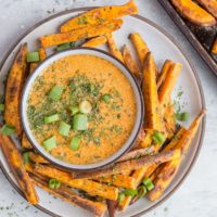 Crispy Baked Sweet Potato Fries with Chipotle Dipping Sauce - a healthy, easy side dish perfect for your burger nights at home | TheRoastedRoot.com