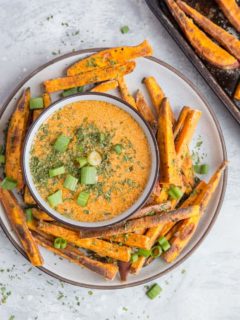 Crispy Baked Sweet Potato Fries with Chipotle Dipping Sauce - a healthy, easy side dish perfect for your burger nights at home | TheRoastedRoot.com
