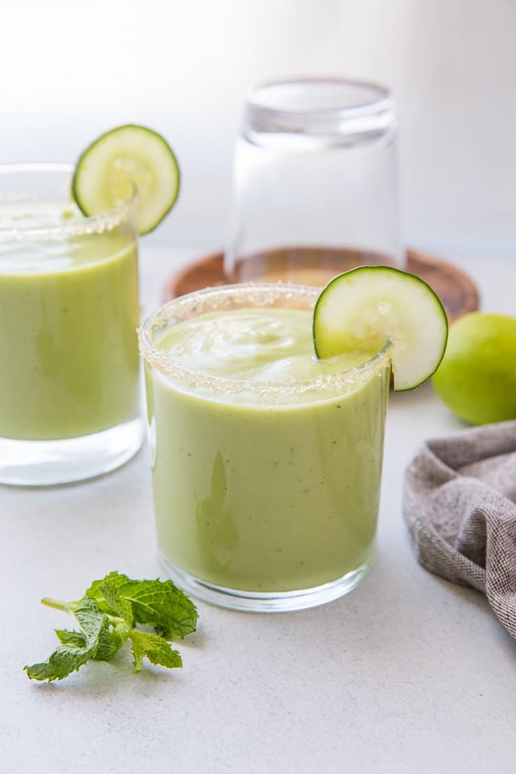 Tropical Avocado Cocktail with mango, pineapple juice, coconut milk, cucumber, mint and lime. These healthy refined sugar-free cocktails are refreshing and delicious!