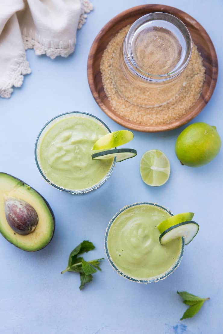 Tropical Avocado Cocktail with mango, pineapple juice, coconut milk, cucumber, mint and lime. These healthy refined sugar-free cocktails are refreshing and delicious!