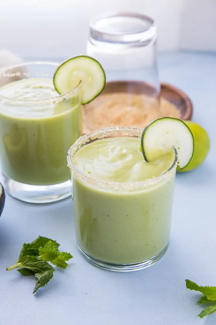 Tropical Avocado Cocktail with mango, pineapple juice, coconut milk, cucumber, mint and lime. These healthy refined sugar-free cocktails are refreshing and delicious!