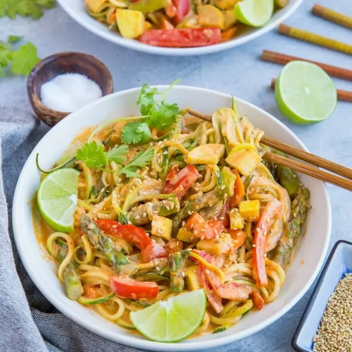 This plant-based vegan red curry zucchini noodle bowl is fresh, frisky, and comforting while keeping it low-carb. I’ll be the first to admit I don’t reinvent the wheel when it comes to curry. I make curry nearly weekly, and while I can 200% go the authentic route by grinding my own spice blend, I am not at all above using a store-bought curry paste. It just makes dinner easy in a pinch!