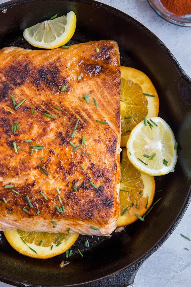 Paleo Low-Carb Lemon Salmon with orange and ghee sauce. This healthy salmon recipe is easy to prepare and absolutely delicious!