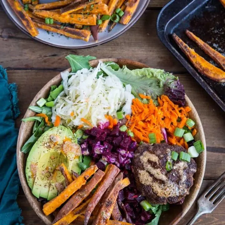 Burger Bowls with Chipotle Sauce, sauerkraut, pickled beets, carrots, mixed greens and avocado - a nutritious approach to hamburgers!