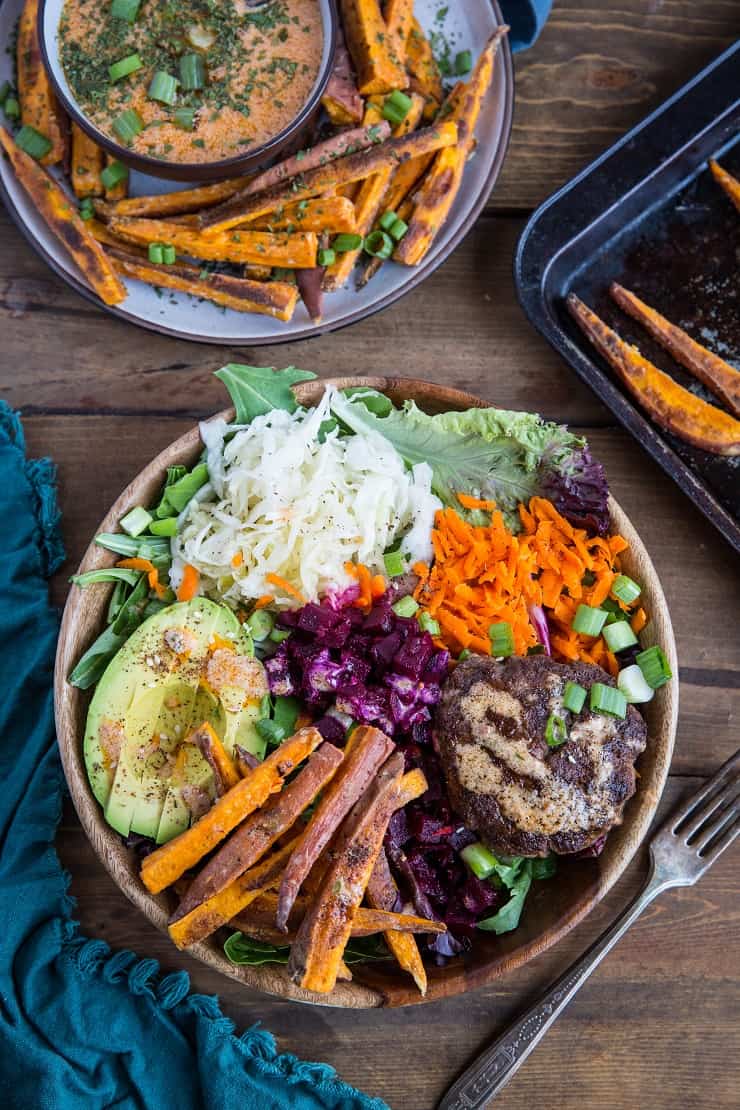 Burger Bowls with Chipotle Sauce, sauerkraut, pickled beets, carrots, mixed greens and avocado - a nutritious approach to hamburgers!