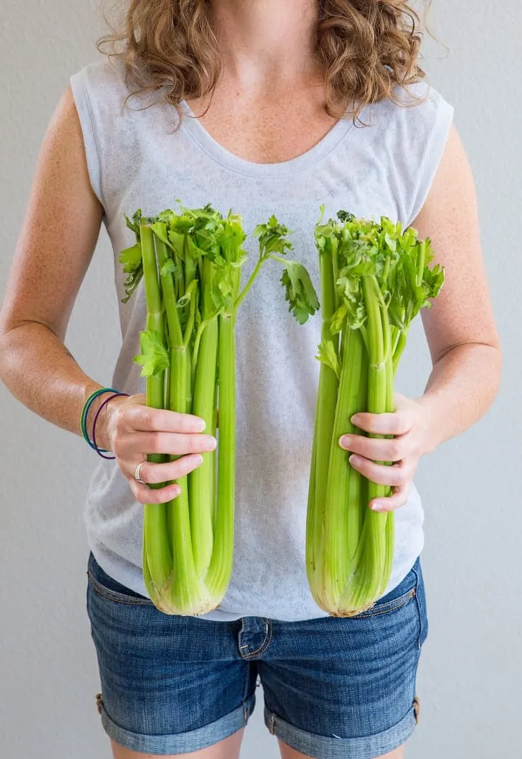 Julia Mueller holding celery for celery juice