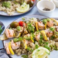 Grilled Salmon Kabobs with pesto sauce and quinoa - a quick, easy, nutritious meal | TheRoastedRoot.com #glutenfree #paleo #primal #healthy