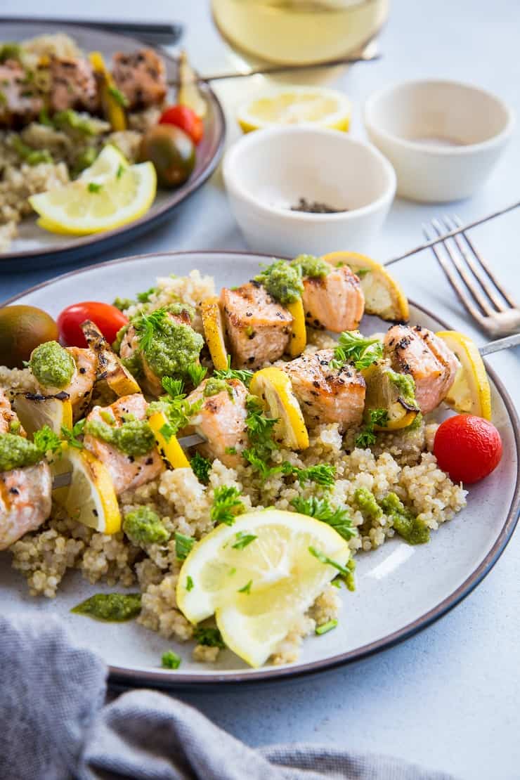 Quick and Easy Grilled Salmon Kabobs with pesto sauce and quinoa - a deliciously healthy clean meal | TheRoastedRoot.net #glutenfree #paleo #primal