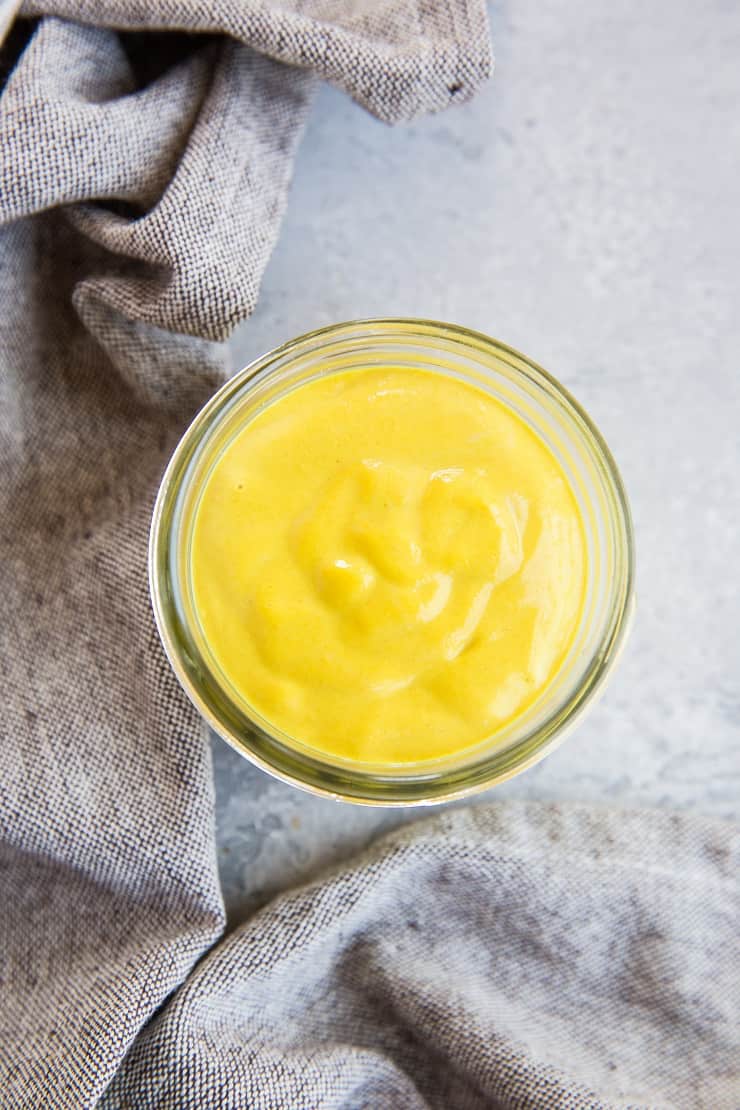 Superfood Orange Turmeric Tahini Sauce - a paleo, vegan sauce recipe that's packed with nutrients and is absolutely delicious - perfect for drizzling on all your bowls | TheRoastedRoot.net