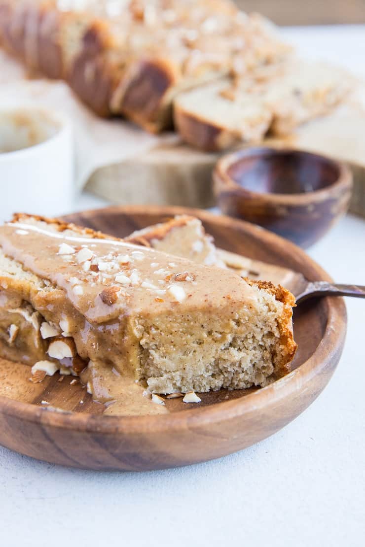 Paleo Banana Bread with Almond Butter Glaze - a deliciously moist and fluffy grain-free banana bread recipe that is dairy-free and refined sugar-free. The almond butter glaze is sinfully delicious | TheRoastedRoot.com