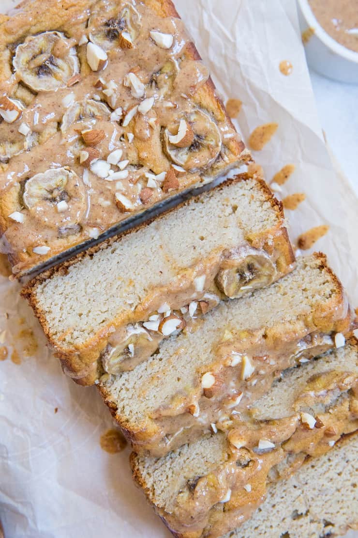 Paleo Banana Bread with Almond Butter Glaze - a deliciously moist and fluffy grain-free banana bread recipe that is dairy-free and refined sugar-free. The almond butter glaze is a MUST!