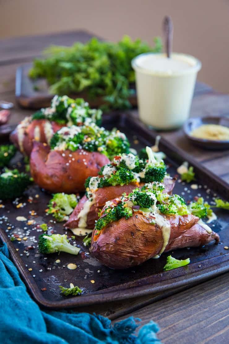 Vegan Broccoli "Cheddar" Stuffed Sweet Potatoes with a homemade dairy-free "cheese" sauce - a clean and simple weeknight side dish or meal. | TheRoastedRoot.net #glutenfree #paleo #vegetarian