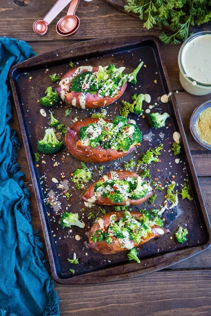 Vegan Broccoli "Cheddar" Stuffed Sweet Potatoes with a homemade dairy-free "cheese" sauce - a clean, simple paleo and vegetarian weeknight side dish or meal. | TheRoastedRoot.net #glutenfree #paleo #vegetarian