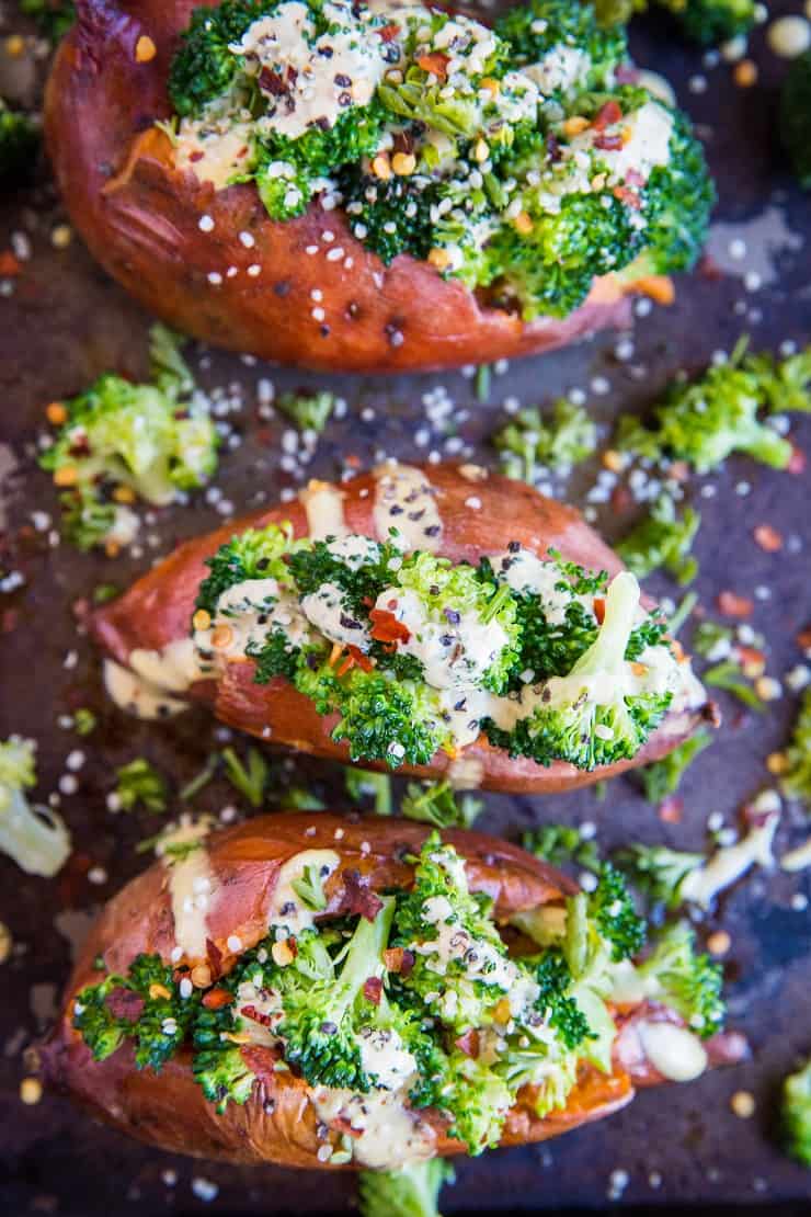 Vegan Broccoli "Cheddar" Stuffed Sweet Potatoes with a homemade dairy-free "cheese" sauce - a clean, simple paleo and vegetarian weeknight side dish or meal. | TheRoastedRoot.net #glutenfree #paleo #vegetarian