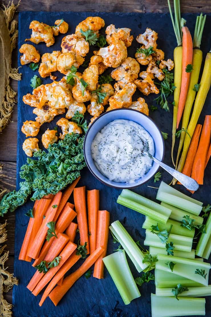 Buffalo Cauliflower Bites - a vegetarian version of buffalo wings made paleo, keto, low-carb, and whole30. A great appetizer for football season! | TheRoastedRoot.net #glutenfree #ketorecipe