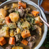 Paleo Instant Pot Beef Stew with parsnips, carrots, butternut squash. A potato-free stew recipe that is paleo, whole30, and AIP-friendly | TheRoastedRoot.net #glutenfree