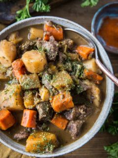 Paleo Instant Pot Beef Stew with parsnips, carrots, butternut squash. A potato-free stew recipe that is paleo, whole30, and AIP-friendly | TheRoastedRoot.net #glutenfree