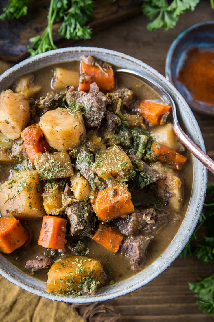 Paleo Instant Pot Beef Stew with parsnips, carrots, butternut squash. A potato-free stew recipe that is paleo, whole30, and AIP-friendly | TheRoastedRoot.net #glutenfree