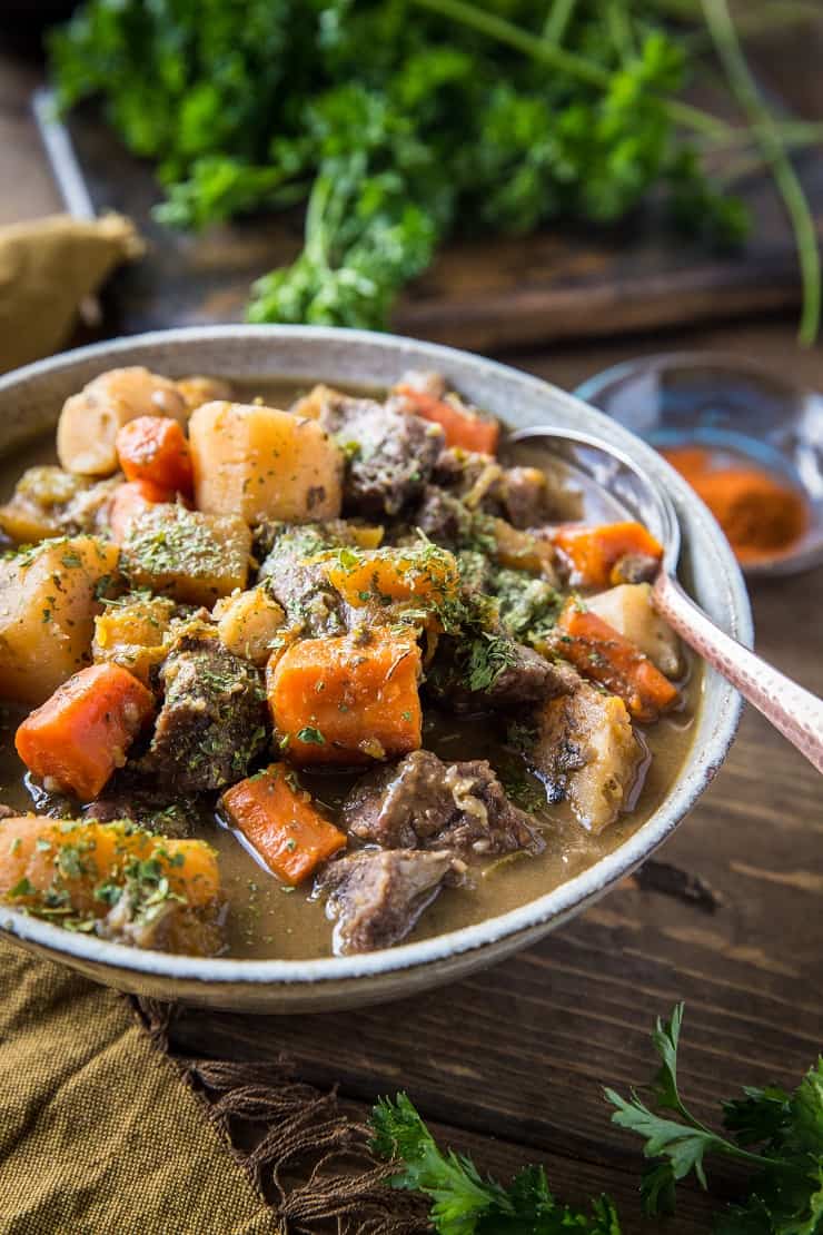 Paleo Instant Pot Beef Stew with parsnips, carrots, butternut squash. A potato-free stew recipe that is paleo, whole30, and AIP-friendly | TheRoastedRoot.net #glutenfree